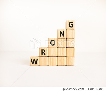 Wrong symbol. Concept word Wrong on beautiful wooden blocks. Beautiful white table white background. Business lifestyle wrong concept. Copy space. Wrong symbol. Concept word Wrong on beautiful wooden blocks. Beautiful white table white background. Business lifestyle wrong concept. Copy space. 130406385
