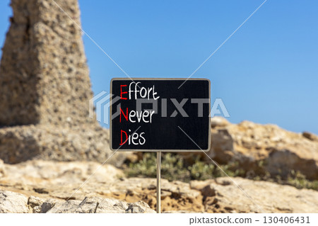 END effort never dies symbol. Concept words END effort never dies on beautiful yellow blackboard. Beautiful stone blue sky background. Business END effort never dies concept. Copy space. END effort never dies symbol. Concept words END effort never dies on beautiful yellow blackboard. Beautiful stone blue sky background. Business END effort never dies concept. Copy space. 130406431