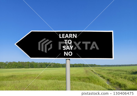 Learn to say no symbol. Concept words phrase Learn to say no on beautiful black road sign. Beautiful blue sky green grass lawn background. Business psychological Learn to say no concept. Copy space. 130406475