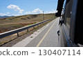 Vehicle driving through scenic mountain highway in summer 130407114