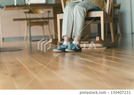 sit in a rocking chair 130407231