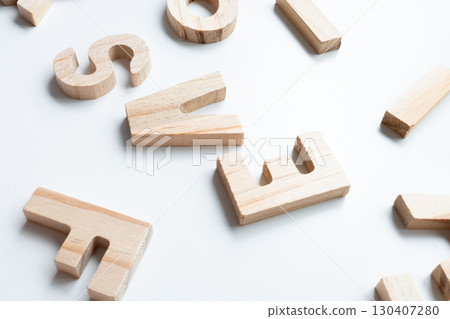 Scattered wooden alphabet letters on white background Scattered wooden alphabet letters on white background 130407280