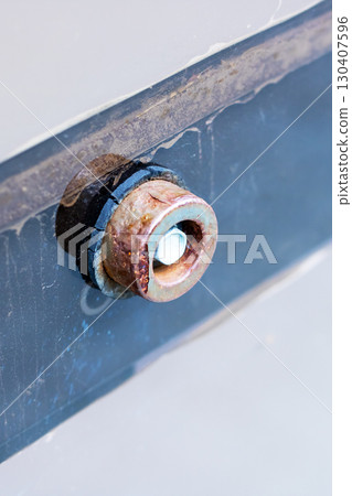 Close-up of Rusty Mechanical Part on Metal Surface Close-up of Rusty Mechanical Part on Metal Surface 130407596
