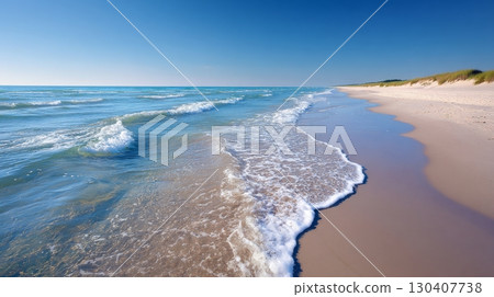 Sunlit sandy beach with gentle waves under a clear blue sky, serene landscape Sunlit sandy beach with gentle waves under a clear blue sky, serene landscape 130407738