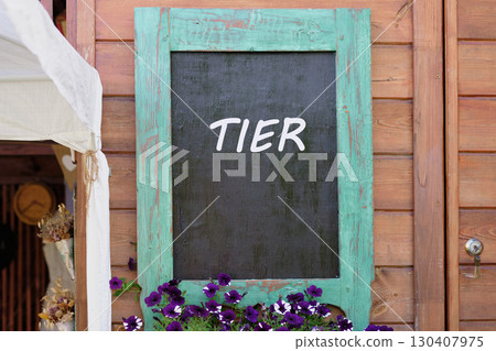 Strategy to control concept. Copy space. TIER word written on Charming wooden wall with a turquoise-framed chalkboard Strategy to control concept. Copy space. TIER word written on Charming wooden wall with a turquoise-framed chalkboard 130407975