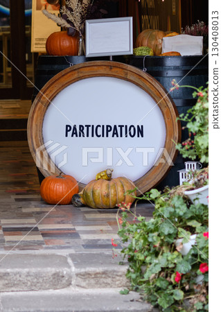 PARTICIPATION concept letters. Copy space. PARTICIPATION word written on Vibrant autumn display with colorful pumpkins and rustic decor 130408013