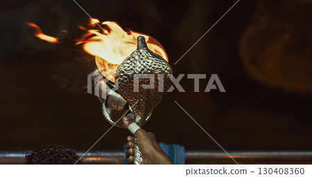 Varanasi, Uttar Pradesh, India. Candle Holder With Lit Candles On Ganga Maha Aarti Ceremony Begins. Fire Puja Ritual In Varanasi. Traditional Ganga Aarti At Ghat 130408360