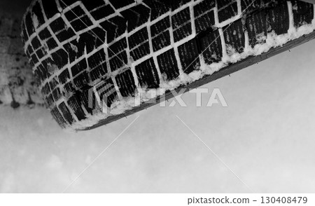 Car winter tire tread with snow between blocks stock photo  130408479
