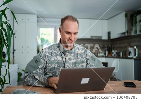 American Soldier Working From Home on Laptop American Soldier Working From Home on Laptop 130408793