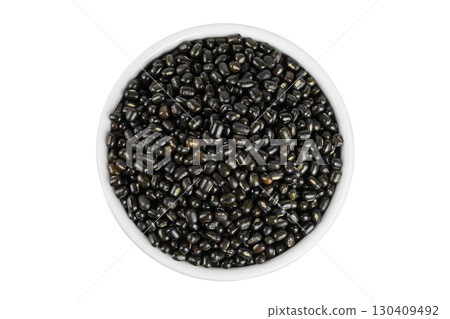 Black bean or Urad dal, black gram, vigna mungo in ceramic bowl isolated on the white background. Top view. Flat lay. 130409492