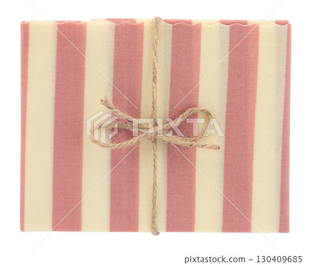 Beeswax food wrap isolated on transparent background, folded and with burlap string bow. Eco friendly and zero waste kitchen concept, organic lifestyle and minimalist mockup. Full focus photo Beeswax food wrap isolated on transparent background, folded and with burlap string bow. Eco friendly and zero waste kitchen concept, organic lifestyle and minimalist mockup. Full focus photo 130409685