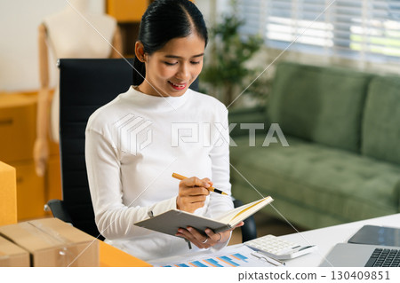 Entrepreneur working at home. Online shopping, e-commerce, internet banking, spending money, working from home concept. Entrepreneur working at home. Online shopping, e-commerce, internet banking, spending money, working from home concept. 130409851