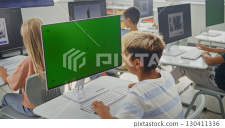 Primary School Boy Working on Creative Project on PC Monitor with Chroma Key During Digital Art Class Primary School Boy Working on Creative Project on PC Monitor with Chroma Key During Digital Art Class 130411336
