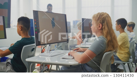Elementary School Children Using Computers, Creating Digital Illustrations During Digital Art Lesson 130411430