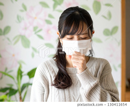 Healthy image of a Japanese woman wearing a mask coughing 130411654