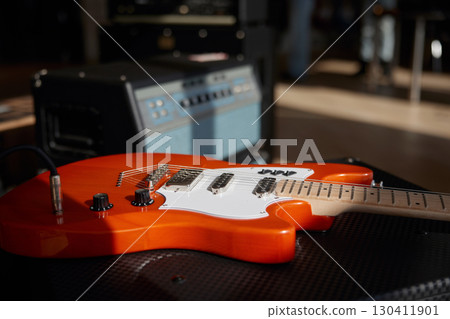 Guitar with a volume knob for sound adjustments close-up Guitar with a volume knob for sound adjustments close-up 130411901