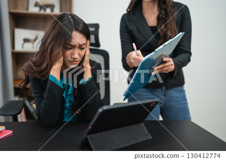 Frustrated Businesswoman During Meeting with Colleague, Expressing Feelings and Ideas 130412774