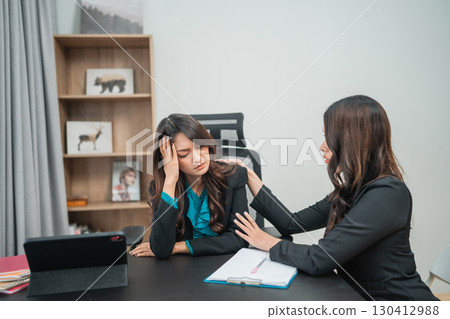 Supportive and Encouraging Conversation in a Professional Setting Between Two Women Supportive and Encouraging Conversation in a Professional Setting Between Two Women 130412988
