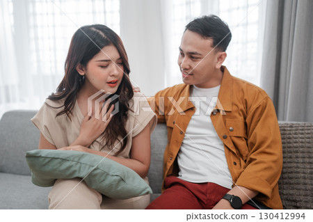 An Emotional Conversation Occurring Between Two Young Adults in a Cozy Setting An Emotional Conversation Occurring Between Two Young Adults in a Cozy Setting 130412994