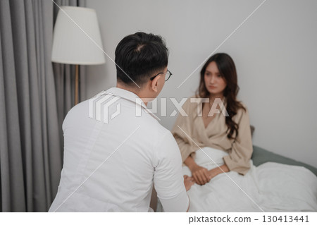 Consultation Session Between Doctor and Patient in Modern Bedroom Setting Consultation Session Between Doctor and Patient in Modern Bedroom Setting 130413441