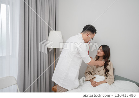 A Doctor Conducting an InDepth Examination of a Patient in a Modern Healthcare Setting A Doctor Conducting an InDepth Examination of a Patient in a Modern Healthcare Setting 130413496