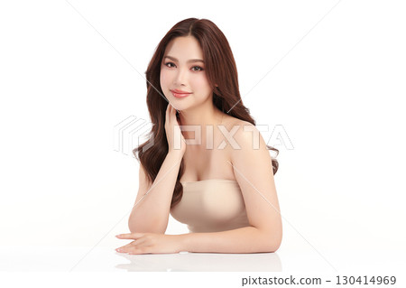 A beautiful young Asian woman with clean, fresh skin against a white background. Skincare, facial treatment, cosmetology, beauty, and spa. An elegant portrait of an Asian woman. A beautiful young Asian woman with clean, fresh skin against a white background. Skincare, facial treatment, cosmetology, beauty, and spa. An elegant portrait of an Asian woman. 130414969