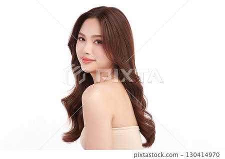 A beautiful young Asian woman with clean, fresh skin against a white background. Skincare, facial treatment, cosmetology, beauty, and spa. An elegant portrait of an Asian woman. 130414970