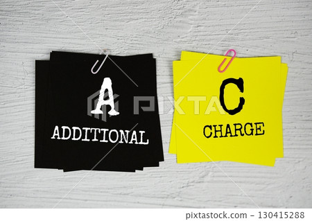 AC - Additional Charge text message on stick note on concrete background 130415288