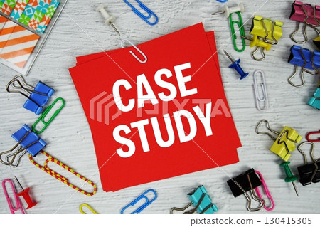 Case Study text on stick note with stationery on concrete background Case Study text on stick note with stationery on concrete background 130415305