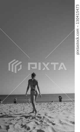 A Relaxing Beach Stroll Experience Captured in Timeless Black and White Photography 130415473
