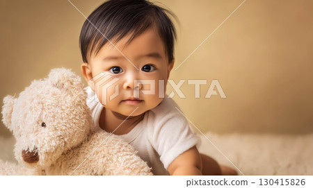 close up of baby boy lying on the bed 130415826