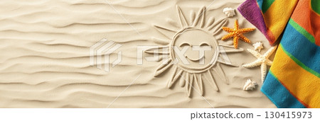 Smiling sun drawing on the sand of a beach with a colorful striped beach towel and starfishes, evoking summer holidays, relaxation, and travel destinations 130415973