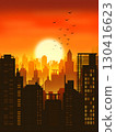 Cityscape during sunset. Silhouettes of buildings and skyscrapers with bright sunlight at the background. Beautiful sunset sky over a big city. 130416623