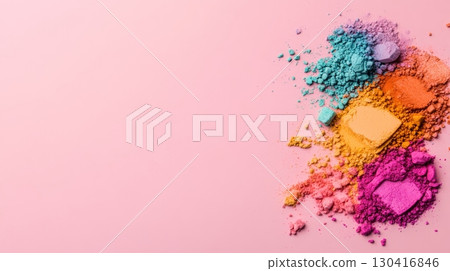 Colorful crushed eyeshadow makeup creates vibrant textures and smears on a pink background, offering a captivating display of beauty products 130416846