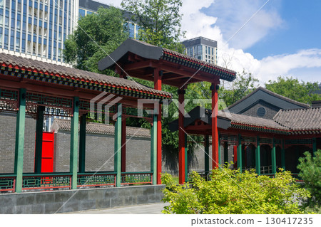 Chinese traditional architecture on a background of a modern skyscrapers Chinese traditional architecture on a background of a modern skyscrapers 130417235