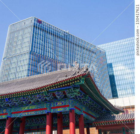 Chinese traditional architecture on a background of a modern skyscrapers in Chinese business center Park Huaming 130417621
