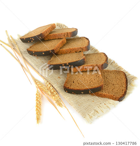 Healthy Dark Bread with Wheat Ears isolated on white. Healthy Dark Bread with Wheat Ears isolated on white. 130417786