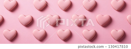 Creating a romantic background, a pattern of pink heart shaped valentine's day candies adds a sweet touch, perfect for greeting cards and enhancing social media posts 130417810