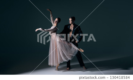 Ballet dancer lifted gracefully by partner in expressive art form 130418584