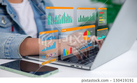Business Data Analytics and Digital Charts Hologram on Laptop Computer for Technology and Marketing 130419191