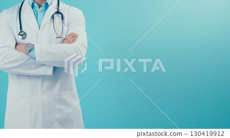 Confident doctor wearing lab coat and stethoscope is crossing his arms on blue background, representing healthcare, professionalism, and medical expertise Confident doctor wearing lab coat and stethoscope is crossing his arms on blue background, representing healthcare, professionalism, and medical expertise 130419912
