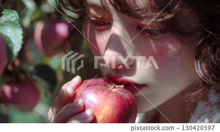 A woman brings her face close to a fresh apple | Fresh, Healthy, Beauty, Autumn, Nature 130420397
