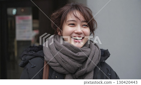 A young woman laughing happily with a big smile | Smile, Woman, Winter, Scarf, Portrait 130420443
