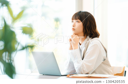A woman thinking/businesswoman A woman thinking/businesswoman 130420535
