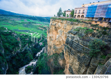 Historic cliffside architecture in Ronda Spain overlooking Guadalevin gorge. 130420798