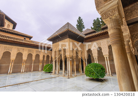 Elegant Arches and Columns in Court of the Lions at Alhambra, Granada, Spain. Elegant Arches and Columns in Court of the Lions at Alhambra, Granada, Spain. 130420818