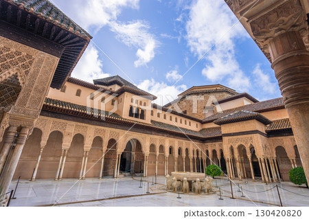 Alhambra Court of the Lions fountain and arches in Granada Spain. Alhambra Court of the Lions fountain and arches in Granada Spain. 130420820