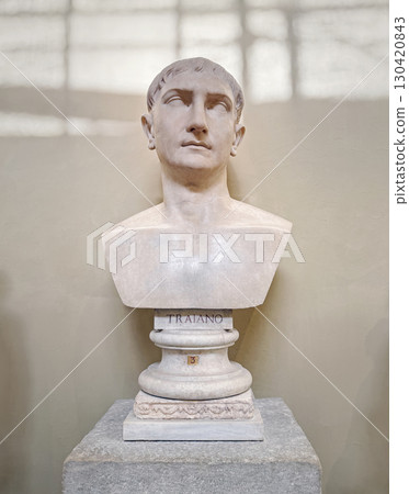 VATICAN CITY, ROME, ITALY - AUGUST 02, 2025 Classical marble bust of Roman Emperor Trajan (Traiano) displayed in the Chiaramonti Museum gallery. Idealised ancient portrait sculpture 130420843