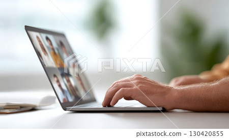 Freelancer engaging in an online meeting with colleagues while working from home, fully embracing the freedom and flexibility of the work and travel lifestyle 130420855
