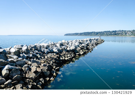 Breakwater rocks at White Rock Pier and the semiahmoo bay inland waters, Surrey, BC, Canada 130421929